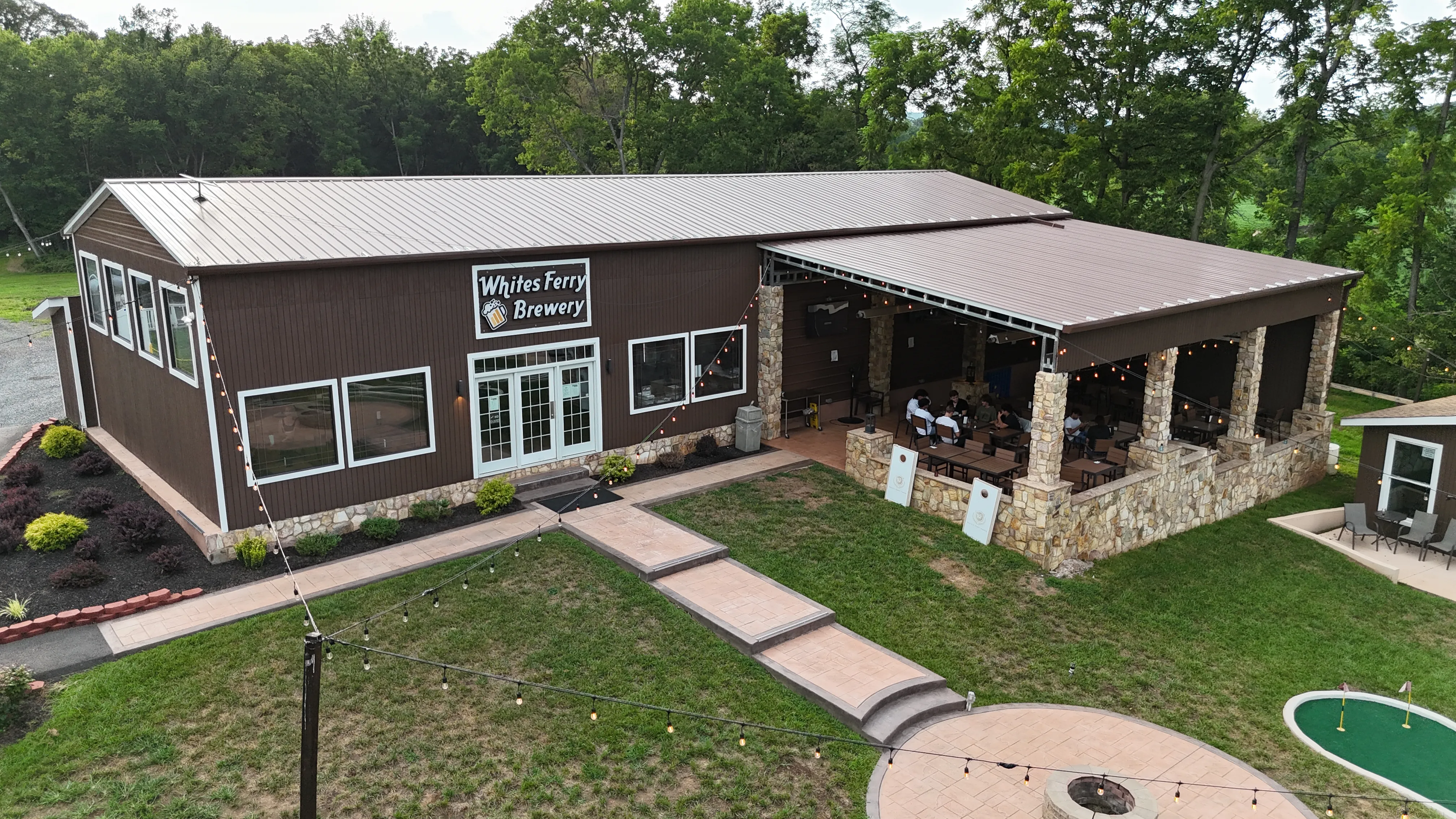 Aerial view of Whites Ferry Brewery grounds with the patio, lawn games and mini golf